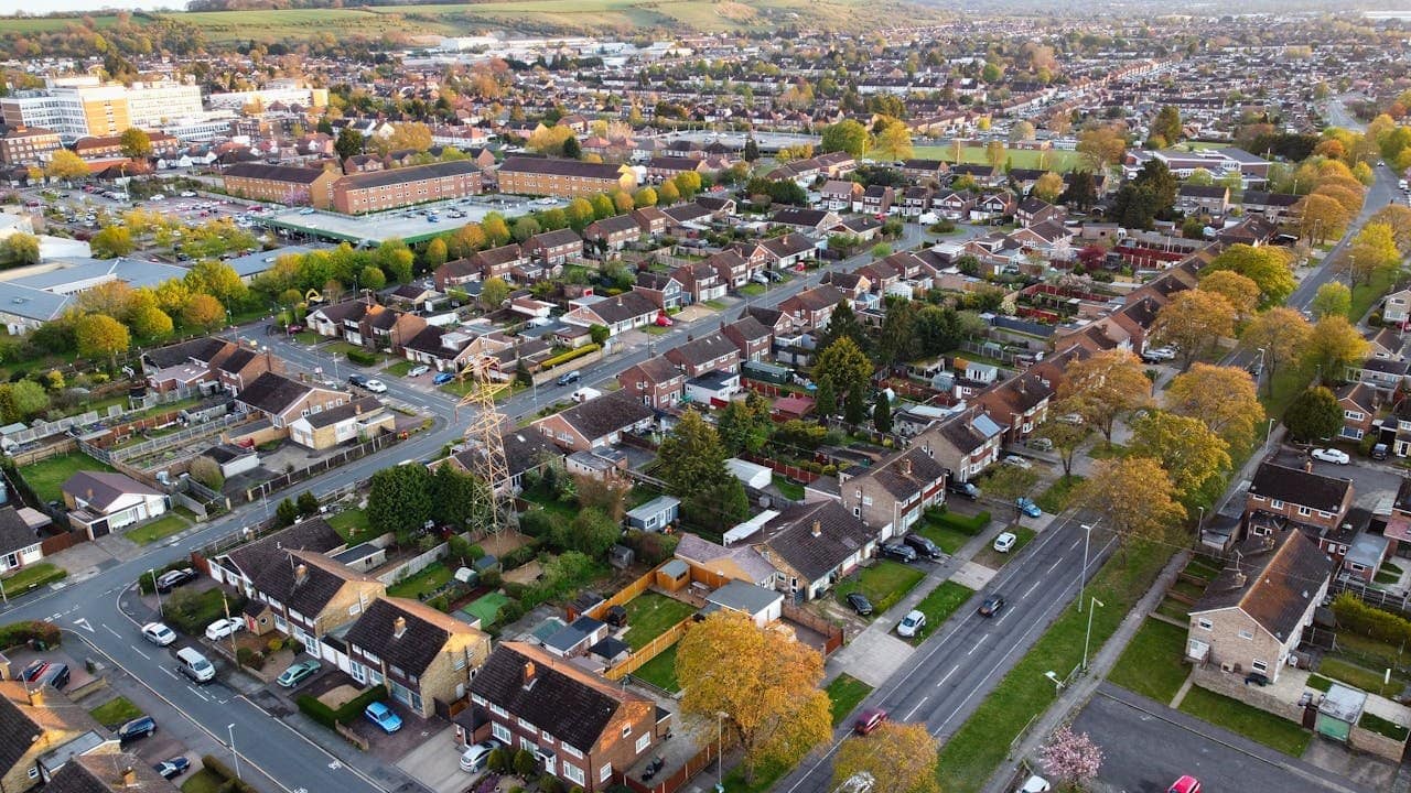 aerial-view-of-houses-and-streets-in-the-city-suburbs-7797488